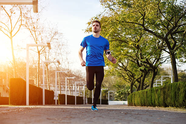 istock male athlete running in the park 467571758