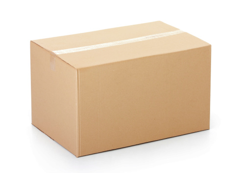 Closed cardboard box taped up and isolated on a white background.