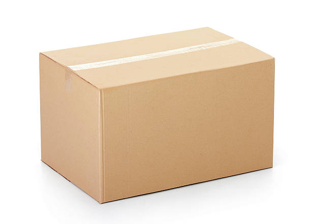Closed cardboard box taped up against white background Closed cardboard box taped up and isolated on a white background. carton stock pictures, royalty-free photos & images