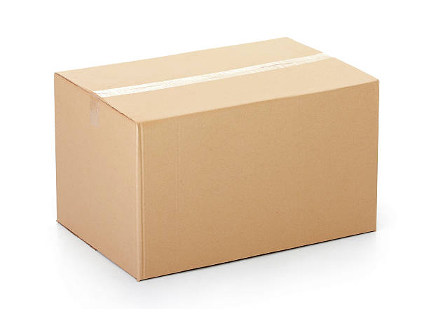 Closed cardboard box taped up against white background Closed cardboard box taped up and isolated on a white background. brown box stock pictures, royalty-free photos & images