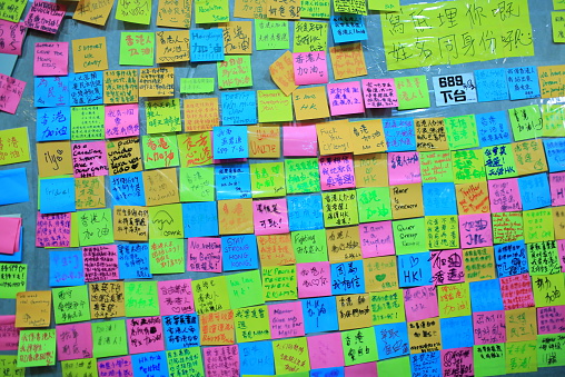 Hong Kong, Сhina - October 1, 2014: people post the memo on the wall of admiralty government offices in Admiralty. Umbrella revolution after two week, people still insist in ocuupy protest.