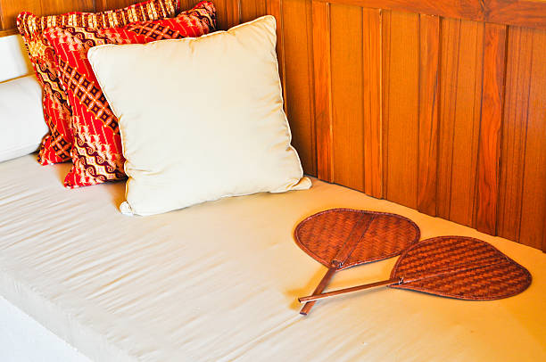 backrest 枕と木製ファン - bedroom bed comfortable double bed ストックフォトと画像