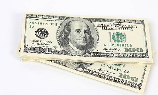 istock Stack of money american hundred dollar bills on white background 467573909