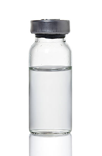 Glass medical bottle containing clear liquid  Medical ampoules bottle empty nobody glass stock pictures, royalty-free photos & images