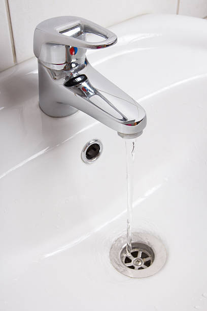 istock Bathroom interior with white sink and silver faucet 467574268