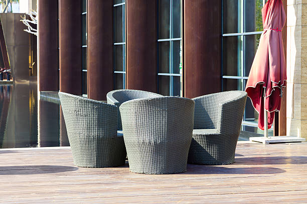 istock Outdoor furniture: A group of  rattan armchairs on terrace 467575953