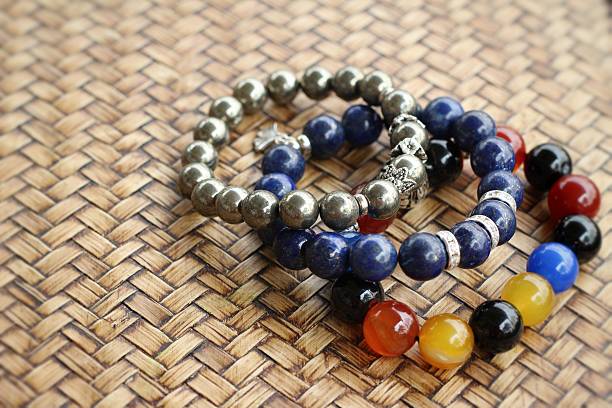 istock Beautiful bracelets placed on the wooden background 467577556