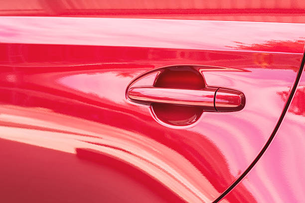 istock Door handle of red car 467578766