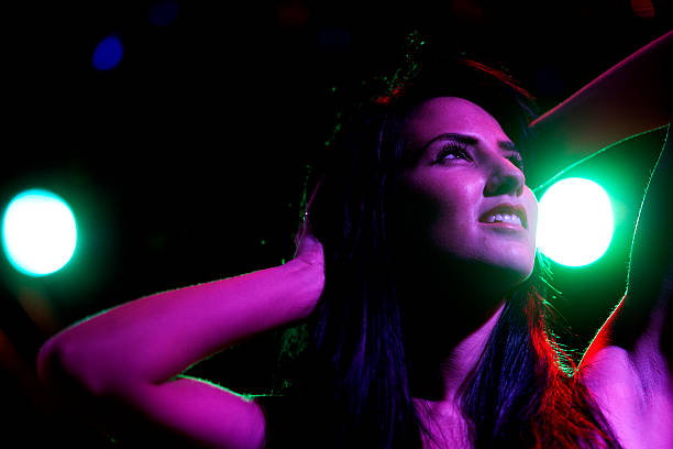 istock Woman dancing in nightclub 467579176