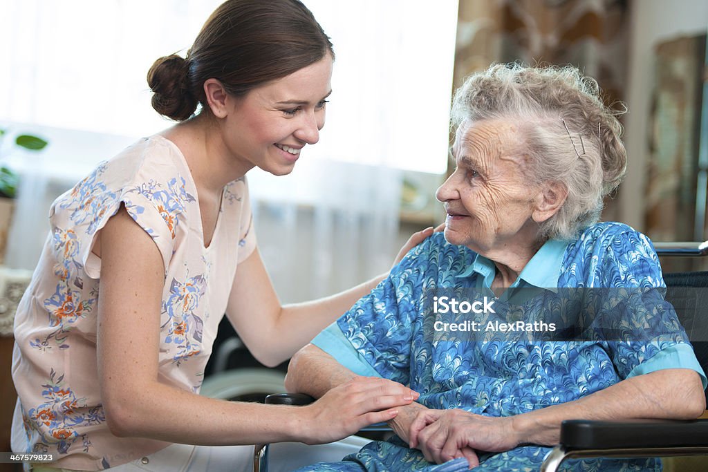 senior woman with home caregiver Elderly woman on wheelchair with a nurse Senior Adult Stock Photo