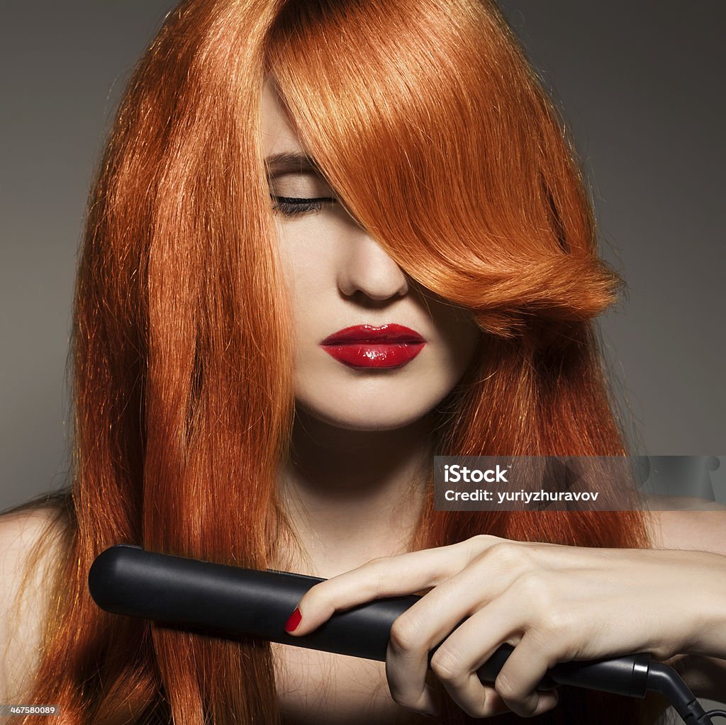 Beautiful Girl. Healthy Long Hair. Curling Tongs Stock Photo