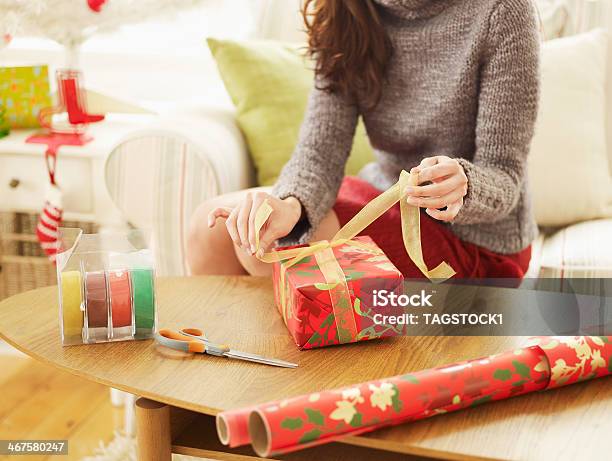 Closeup Of Woman Wrapping Christmas Presents Stock Photo - Download Image Now - Wrapping Paper, Wrapping, One Woman Only