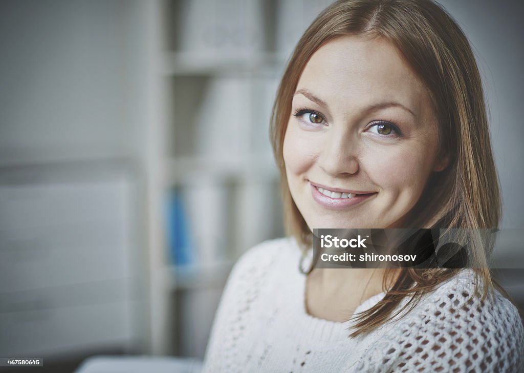 Smiling female Smiling young woman looking at camera in isolation Adult Stock Photo