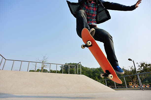istock skateboarding jumping at sunrise 467582868