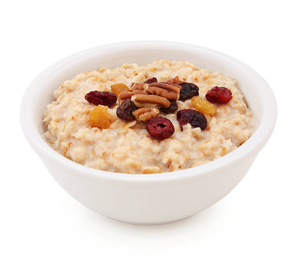 オートミールのボウル、ドライフルーツとナッツ(パス) - oatmeal porridge dried fruit bowl ストックフォトと画像