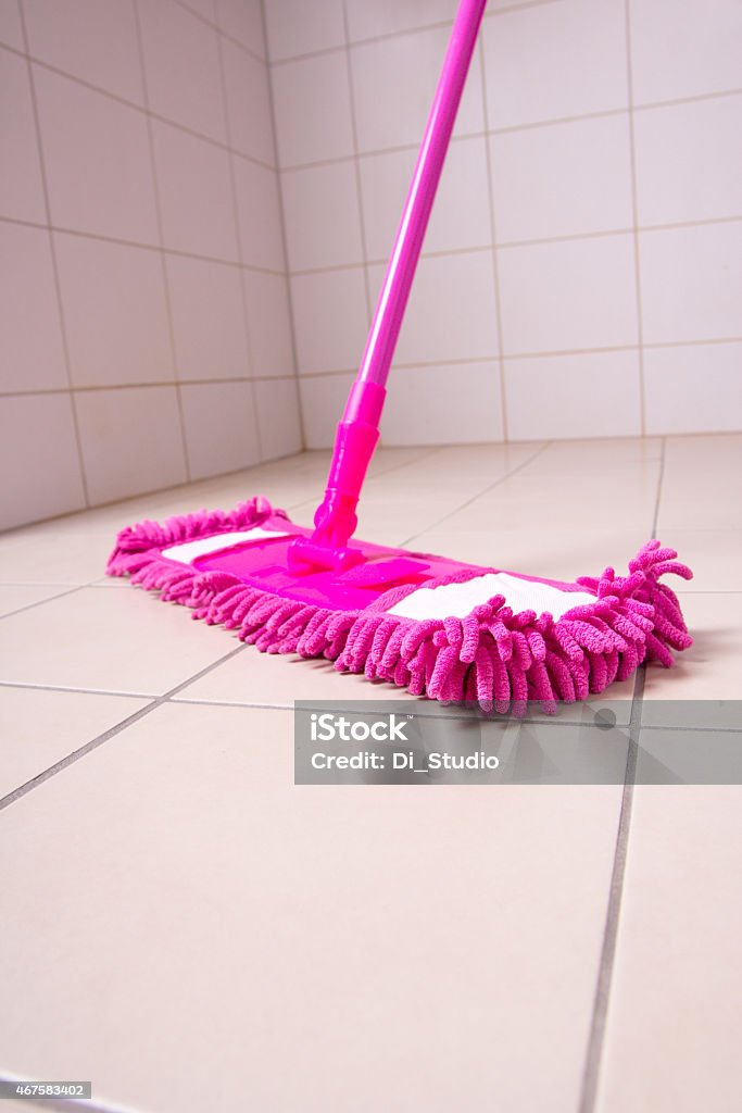 Pink Mop Cleaning Light Tile Floor In Bathroom Stock Photo - Download Image  Now - Flooring, Wet, 2015 - iStock