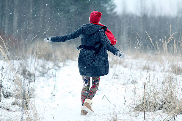 istock happy girl winter snow runs 467583468
