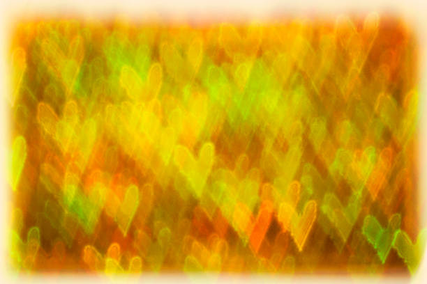istock Abstract yellow and green hearts background. 467587872