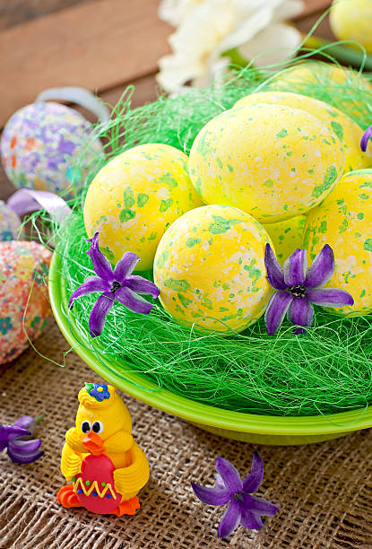 istock Easter eggs and flowers on wooden background 467589518