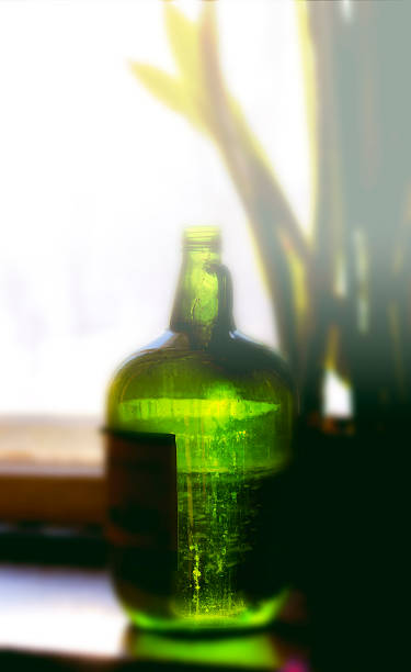 istock Green bottle of water on window 467589572