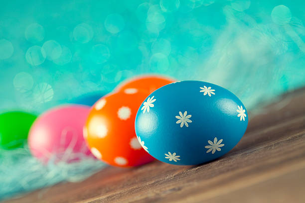 Colored Easter eggs on blue background stock photo