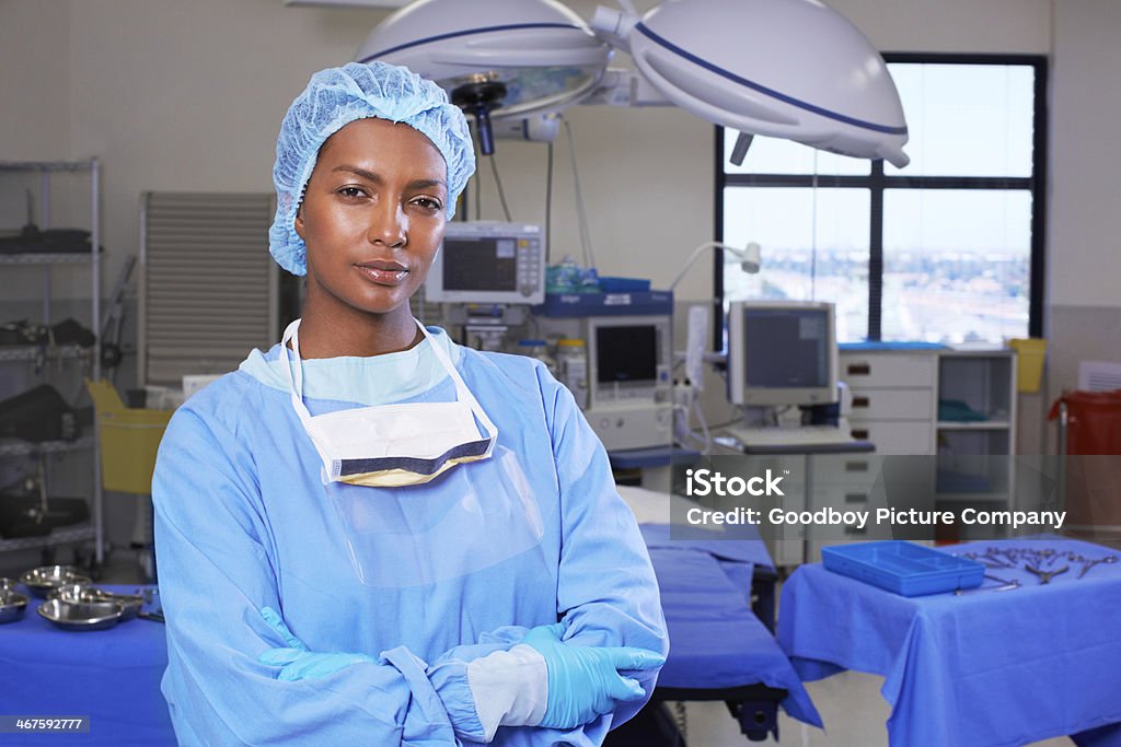 This E.R. is prepped and ready Portrait of a beautiful young african nurse standing in the operating theater Authority Stock Photo