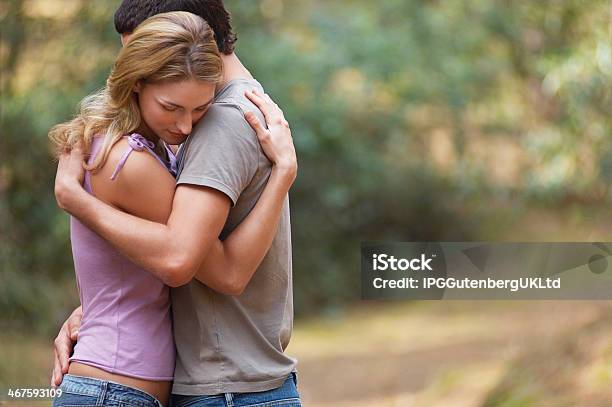 Couple Hugging In Forest Stock Photo - Download Image Now - Adult, Arm Around, Contented Emotion