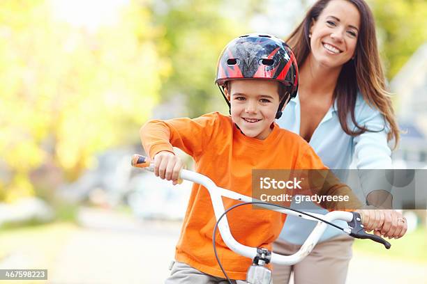 Mom Wont Let Him Fall Stock Photo - Download Image Now - Mother, Cycling, Son