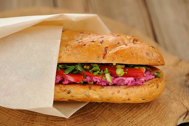 istock Sandwich with beetroot, bell pepper and scallion wrapped in pape 467598856