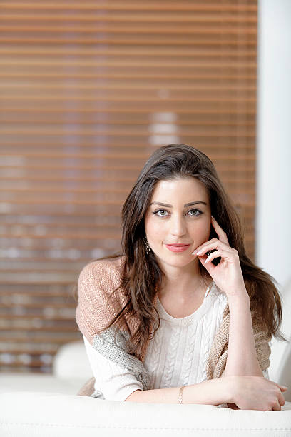 istock Woman relaxing on her sofa 467603646