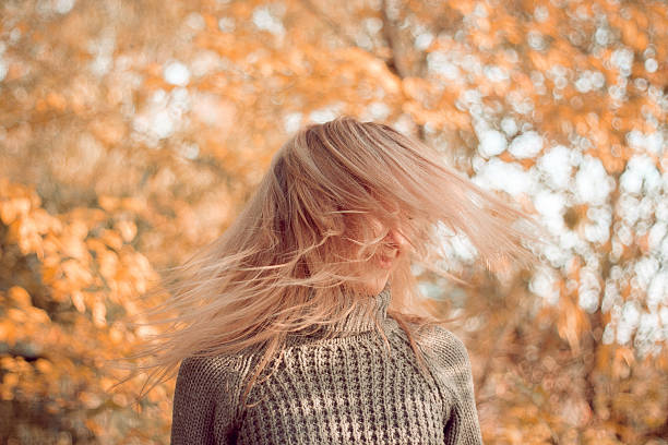 istock woman drop up leaves 467603794