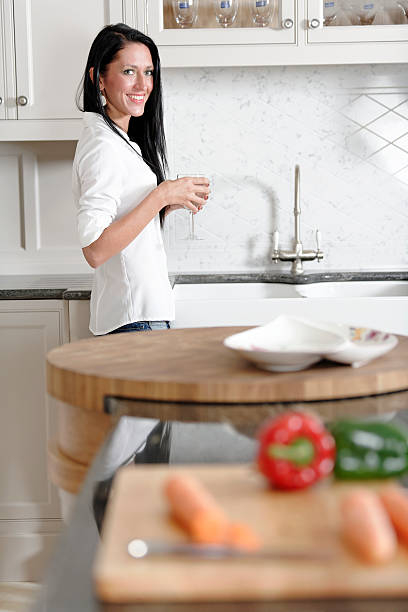 istock Woman preparing a meal in the kitchen 467605102