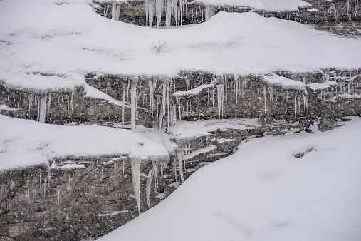 Icicles hang from the rock