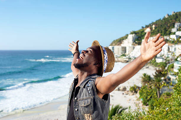 istock Happy african american man with arms outstretched 467607094