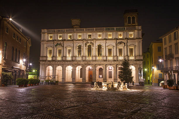 istock Bergamo - Library palace on piazza vecchia at night 467608023