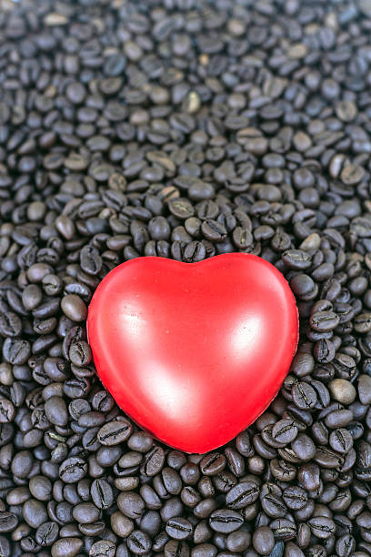 istock red heart on the coffee beans background. 467609828