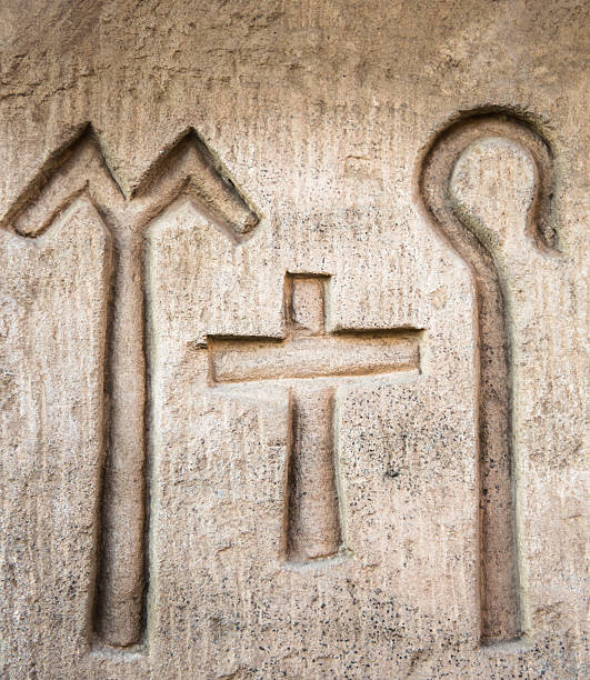 Painted Egyptian Hieroglyphs on the walls of the tomb of the Pharoah Rameses IV at the archaeological site in the Valley of Kings.