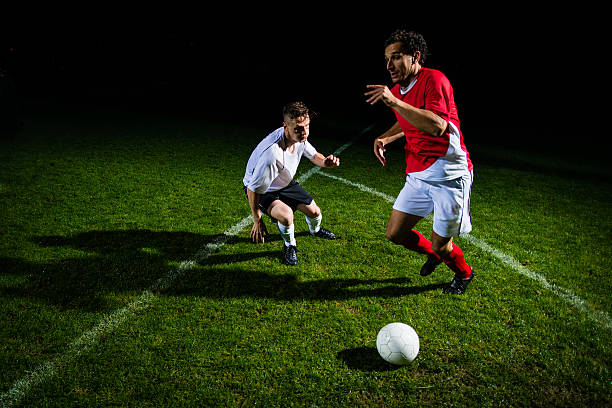 istock Soccer Player Dribbling A Ball 467611096