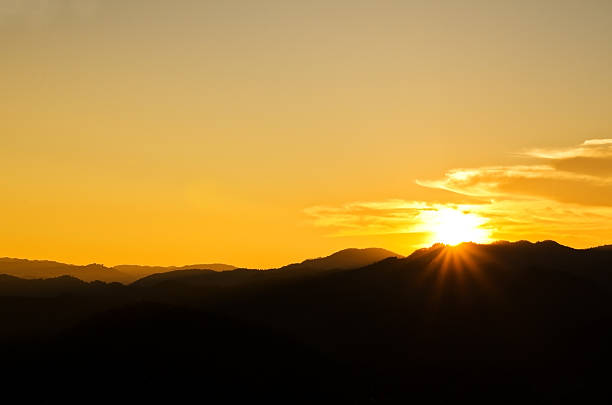 istock Beautiful sunset over silhouette mountain 467611308