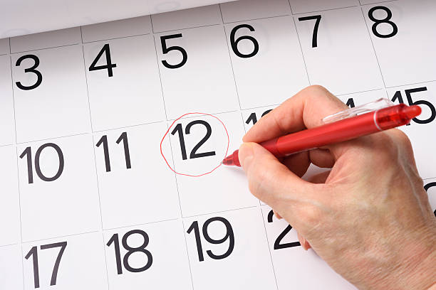 istock Writing in a red round mark on the calendar 467614706