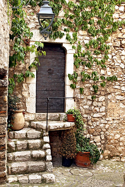 Architectural exterior details from narrow street of ancient city Arles in France