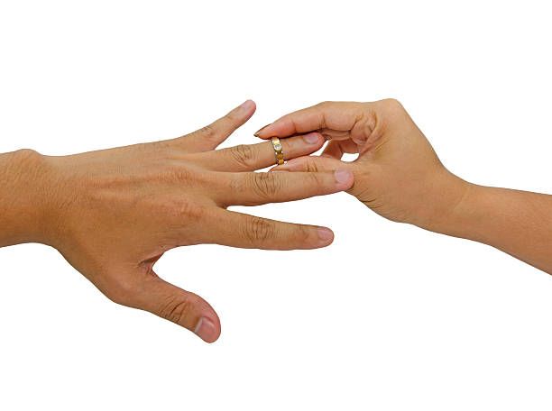 istock woman wears a gold diamond ring to hers Husband 467615559