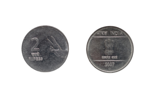 Front view of a group of stacks of golden coins arranged side by side in ascending height order isolated on a white background.