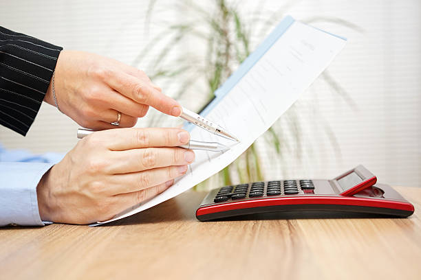istock Lawyer and his client are examining legal document 467618488