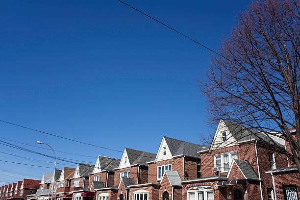 istock Long Row of Brick Homes under Blue Sky 467621176
