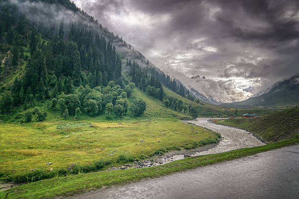storm clouds over mountains of ladakh, Jammu and Kashmir, India storm clouds over mountains and Indus river of ladakh, green valley sccenary, Jammu and Kashmir, India monsoon stock pictures, royalty-free photos & images