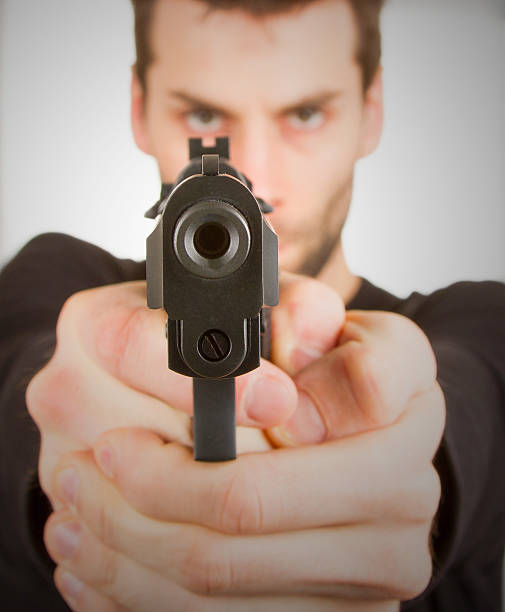 istock Man with a gun ready to shoot 467621791