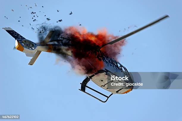 Ground View Looking Up At A Helicopter Exploding Mid Air Stock Photo - Download Image Now