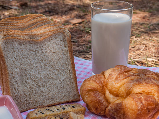 Freshly toasted salt and sesame bread, croissant,milk