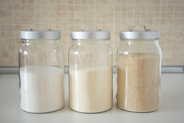 Three containers with flour, breadcrumbs, semolina, in the kitchen